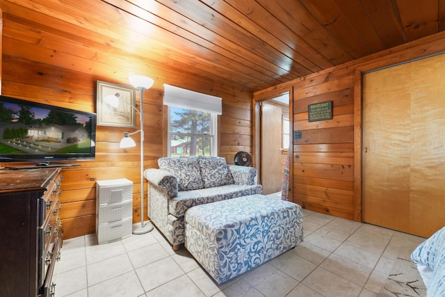 12243 E Houghton Lake Dr, Houghton Lake, MI 48629 - living area with wood walls, light tile patterned floors, and wood ceiling