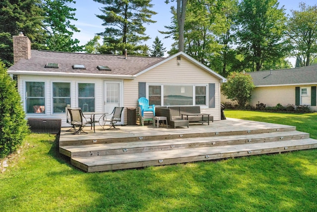 12243 E Houghton Lake Dr, Houghton Lake, MI 48629 - back of property with a chimney, a wooden deck, a yard, and outdoor lounge area