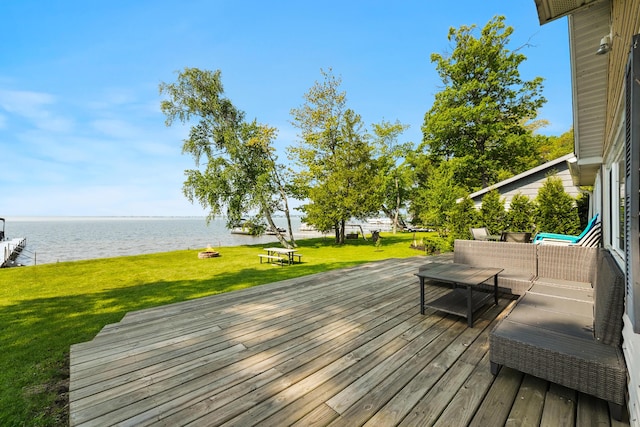 12243 E Houghton Lake Dr, Houghton Lake, MI 48629 - wooden deck featuring a water view, an outdoor hangout area, and a yard