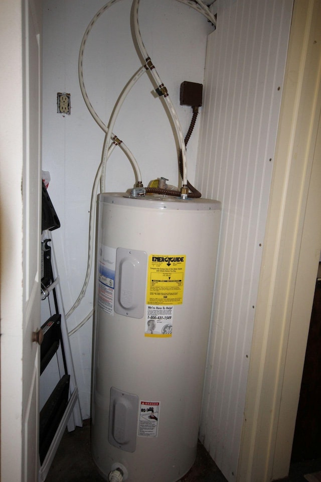 110 Mulberry Ln, Roscommon, MI 48653 - utility room featuring water heater