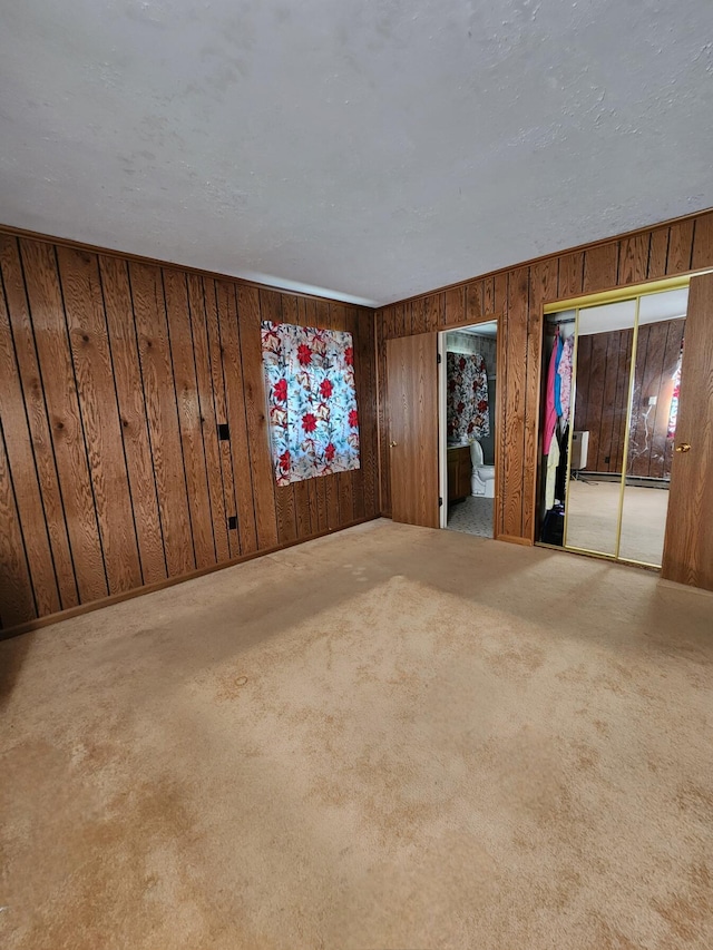 8881 Artesia Beach Rd, Saint Helen, MI 48656 - unfurnished room featuring wood walls