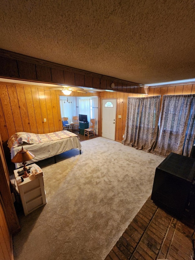 8881 Artesia Beach Rd, Saint Helen, MI 48656 - bedroom featuring a textured ceiling, wood walls, and carpet