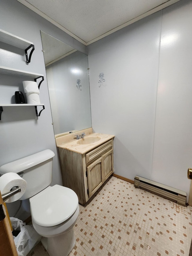 8881 Artesia Beach Rd, Saint Helen, MI 48656 - bathroom with toilet, a baseboard heating unit, vanity, ornamental molding, and baseboards