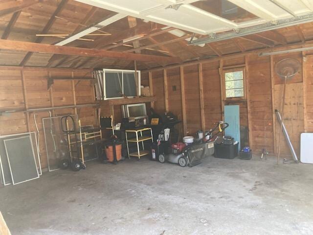 19204 Marlin Ln, Ocqueoc, MI 49759 - garage featuring wooden walls