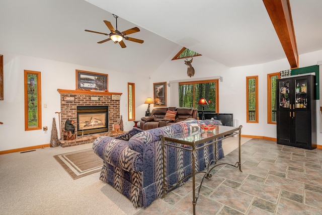 215 Garfield Blvd, Roscommon, MI 48653 - living room featuring baseboards, a ceiling fan, a fireplace, stone finish flooring, and vaulted ceiling