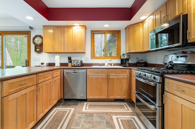 215 Garfield Blvd, Roscommon, MI 48653 - kitchen with stainless steel appliances, a sink, and recessed lighting