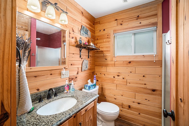 13042 Silver Lake Resort Rd, Wolverine, MI 49799 - bathroom with vanity, toilet, and wooden walls
