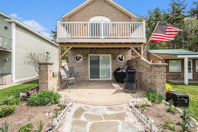 13042 Silver Lake Resort Rd, Wolverine, MI 49799 - back of house featuring brick siding, a patio, and a wooden deck