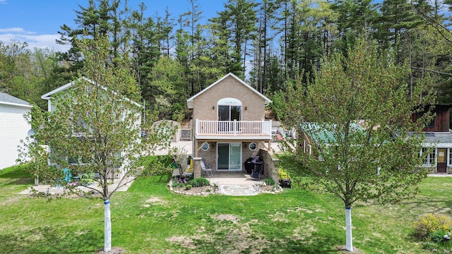 13042 Silver Lake Resort Rd, Wolverine, MI 49799 - view of front of house with a patio, brick siding, a front lawn, and a deck