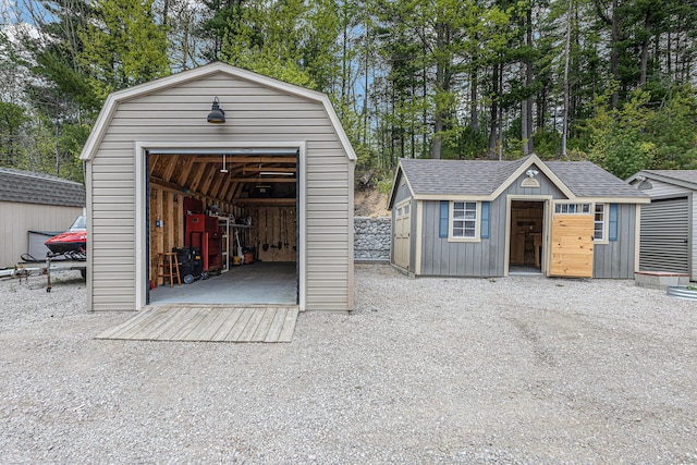 13042 Silver Lake Resort Rd, Wolverine, MI 49799 - detached garage featuring a storage shed