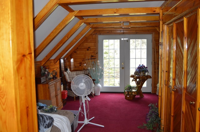4163 Hanson Rd, Lewiston, MI 49756 - bedroom featuring vaulted ceiling, wooden walls, carpet floors, french doors, and access to exterior