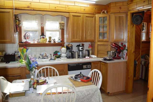 4163 Hanson Rd, Lewiston, MI 49756 - kitchen featuring dishwasher, light countertops, tasteful backsplash, and light tile patterned floors