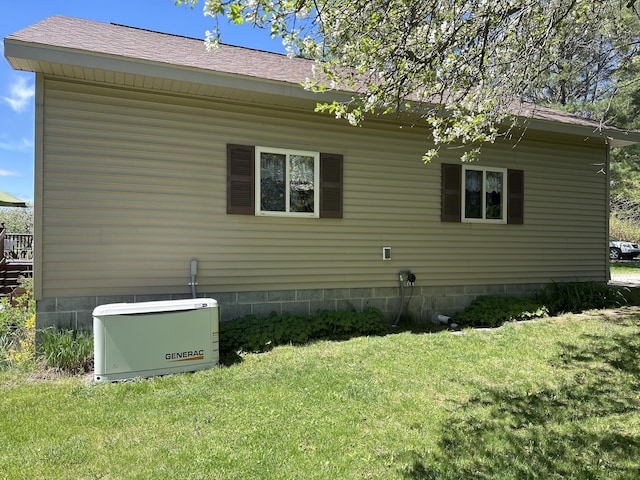 676 N Poor Farm Rd, Harrisville, MI 48740 - view of side of home with a yard