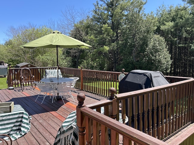 676 N Poor Farm Rd, Harrisville, MI 48740 - wooden terrace featuring outdoor dining area