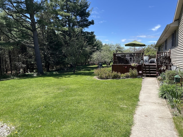 676 N Poor Farm Rd, Harrisville, MI 48740 - view of green lawn featuring a wooden deck