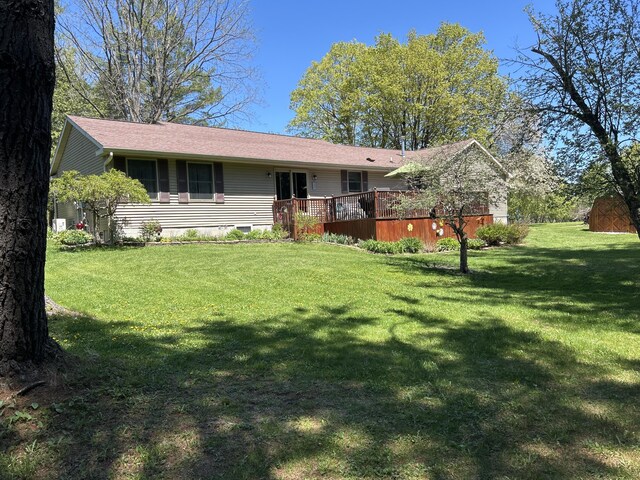 676 N Poor Farm Rd, Harrisville, MI 48740 - ranch-style house featuring a deck, a front lawn, and crawl space