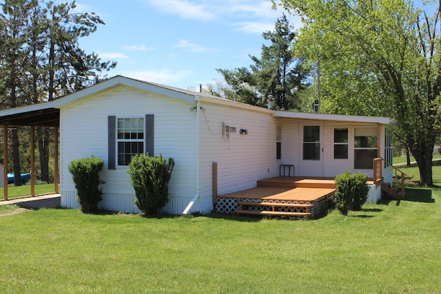 3071 Garling Rd, Fairview, MI 48621 - view of front of home featuring a wooden deck and a front lawn