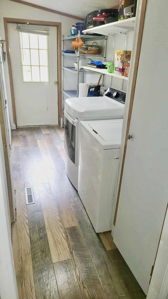 2872 Granger Rd, Lewiston, MI 49756 - washroom with independent washer and dryer and light wood-style flooring