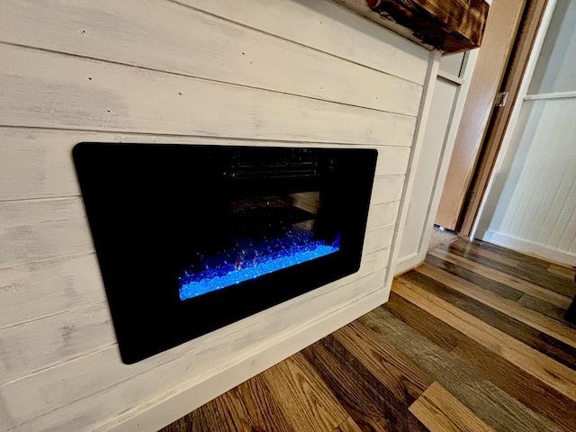 2872 Granger Rd, Lewiston, MI 49756 - detailed view of wood finished floors and a fireplace
