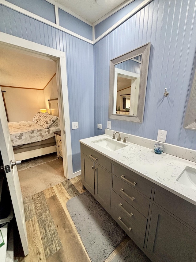 2872 Granger Rd, Lewiston, MI 49756 - ensuite bathroom with wood finished floors and double vanity