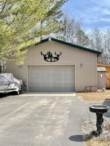2872 Granger Rd, Lewiston, MI 49756 - garage with driveway