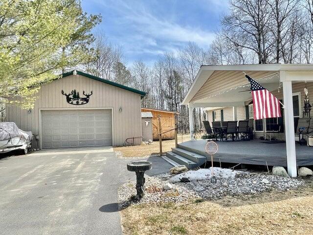 2872 Granger Rd, Lewiston, MI 49756 - view of side of home with an outbuilding and a detached garage