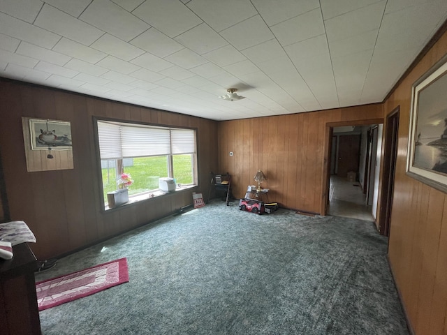 120 S Indiana Ave, Gaylord, MI 49735 - living area with carpet and wooden walls