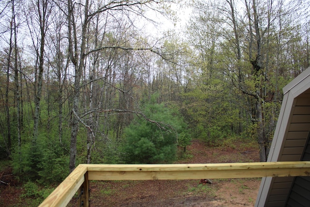 186 S Gerber Rd, Mio, MI 48647 - wooden terrace featuring a forest view