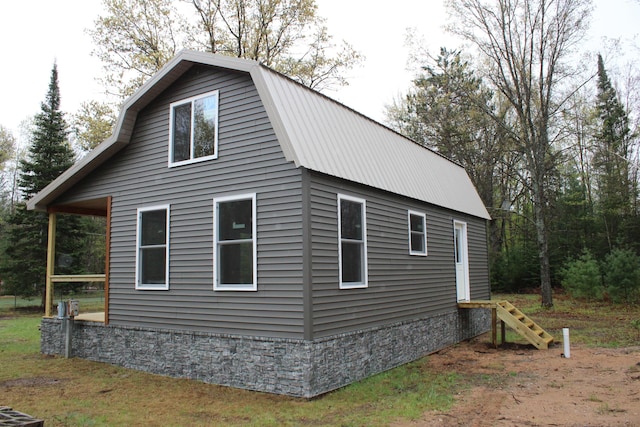 186 S Gerber Rd, Mio, MI 48647 - view of side of property with metal roof and a gambrel roof