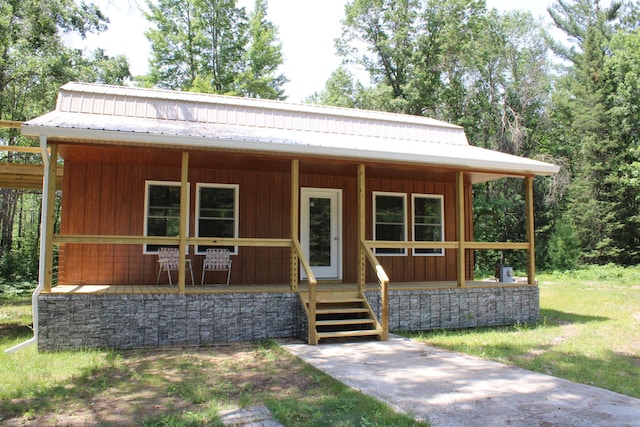 186 S Gerber Rd, Mio, MI 48647 - view of front of house featuring a porch and a metal roof