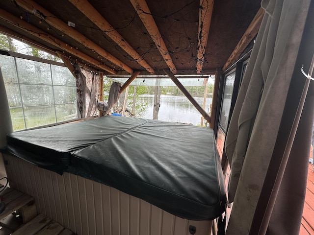 3469 Long Rapids Rd, Alpena, MI 49707 - wooden terrace with a water view, a hot tub, and a boat dock
