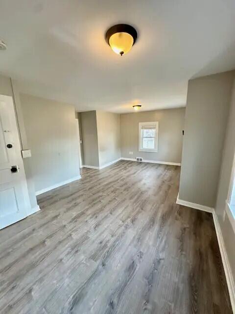 310 W Campbell St, Alpena, MI 49707 - spare room with wood finished floors and baseboards