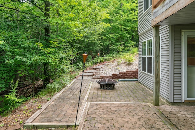 11882 Davis Creek Dr, Wolverine, MI 49799 - view of patio / terrace with a fire pit