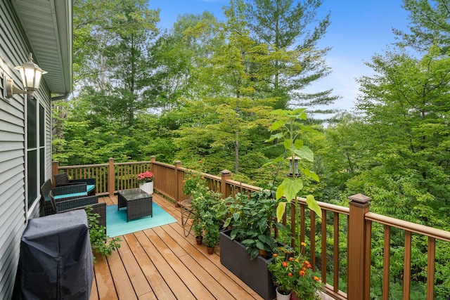 11882 Davis Creek Dr, Wolverine, MI 49799 - wooden deck featuring an outdoor hangout area