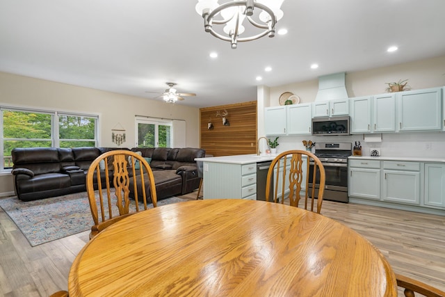 11882 Davis Creek Dr, Wolverine, MI 49799 - dining room featuring light wood-style floors, a chandelier, ceiling fan, and recessed lighting