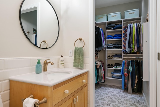 11882 Davis Creek Dr, Wolverine, MI 49799 - bathroom featuring vanity and a spacious closet