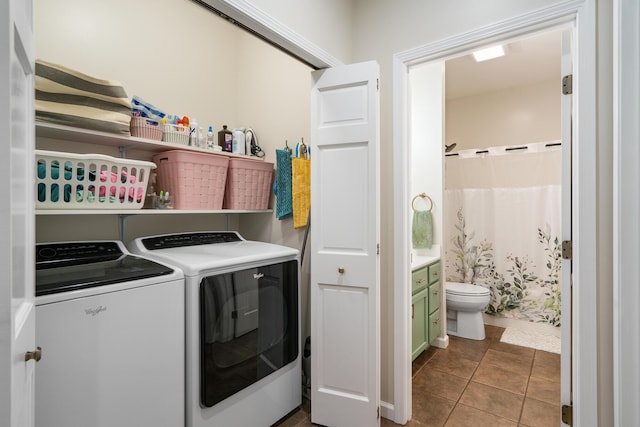 11882 Davis Creek Dr, Wolverine, MI 49799 - washroom featuring washer and dryer and tile patterned floors