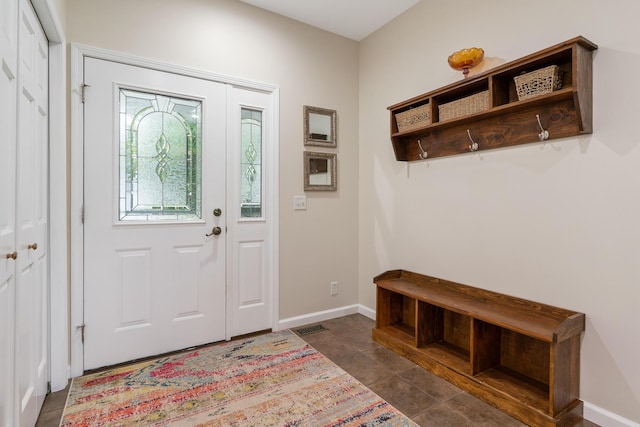 11882 Davis Creek Dr, Wolverine, MI 49799 - foyer entrance with baseboards and dark tile patterned floors