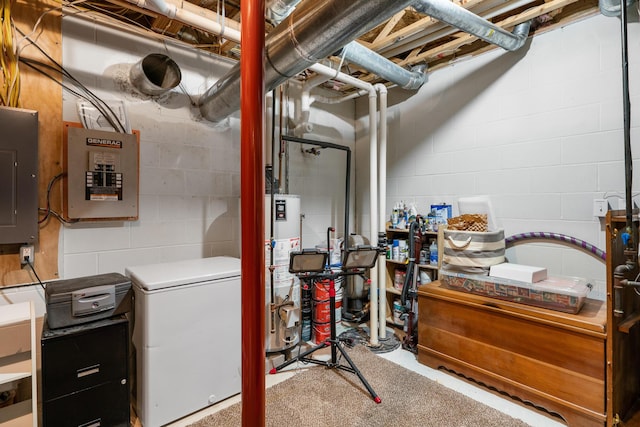 11882 Davis Creek Dr, Wolverine, MI 49799 - unfinished below grade area featuring refrigerator, electric panel, gas water heater, and concrete block wall
