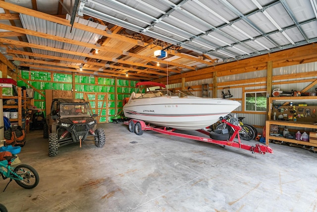 11882 Davis Creek Dr, Wolverine, MI 49799 - garage featuring a garage door opener