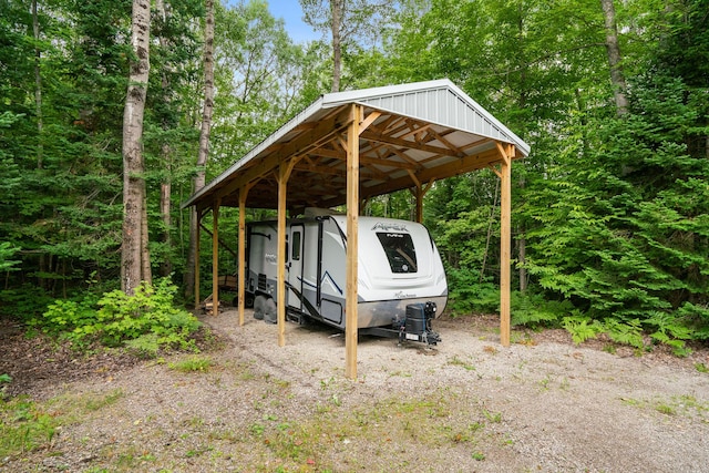 11882 Davis Creek Dr, Wolverine, MI 49799 - view of parking / parking lot with a carport
