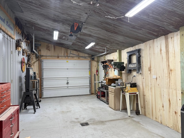 11882 Davis Creek Dr, Wolverine, MI 49799 - garage featuring wooden walls