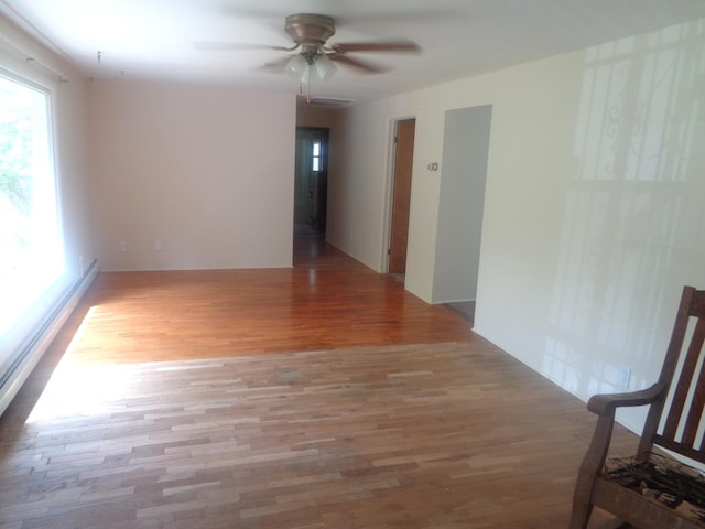 410 Terrace Dr, Houghton Lake, MI 48629 - unfurnished room with plenty of natural light, wood finished floors, and ceiling fan