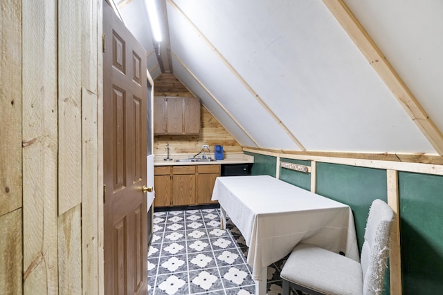 202 E 3rd St, Gaylord, MI 49735 - bonus room featuring vaulted ceiling, a sink, and light flooring