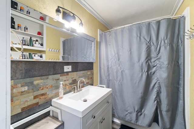 202 E 3rd St, Gaylord, MI 49735 - full bath featuring decorative backsplash, vanity, and a shower with curtain