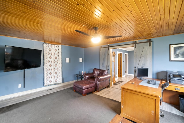 202 E 3rd St, Gaylord, MI 49735 - living room with wooden ceiling, ceiling fan, a desk, and a barn door