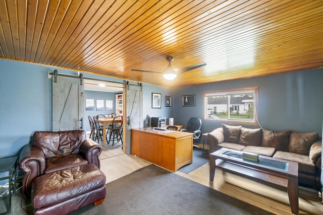 202 E 3rd St, Gaylord, MI 49735 - office area with a barn door, a ceiling fan, wooden ceiling, and light wood-style floors