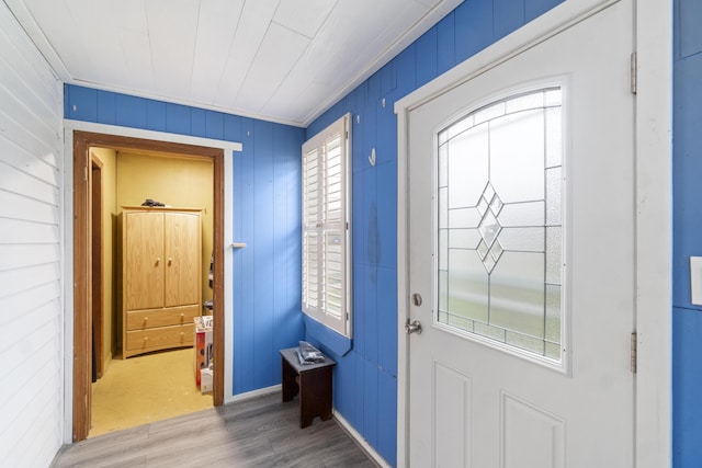 202 E 3rd St, Gaylord, MI 49735 - foyer featuring wood finished floors, healthy amount of natural light, and crown molding