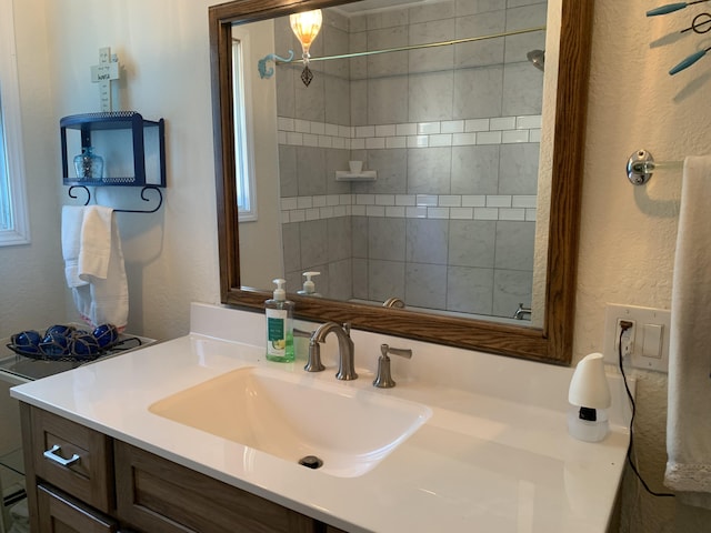 1253 N Partridge Point Rd, Alpena, MI 49707 - bathroom with vanity, a textured wall, and a tile shower