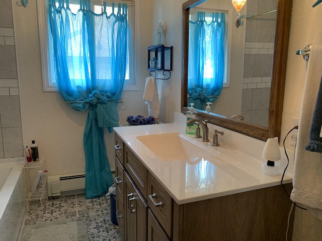1253 N Partridge Point Rd, Alpena, MI 49707 - bathroom featuring baseboard heating, vanity, and tile patterned floors